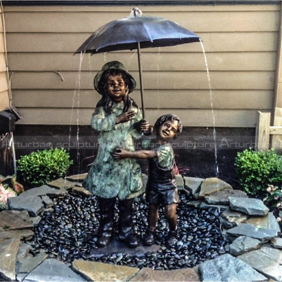 Boy and Girl Under Umbrella Fountain