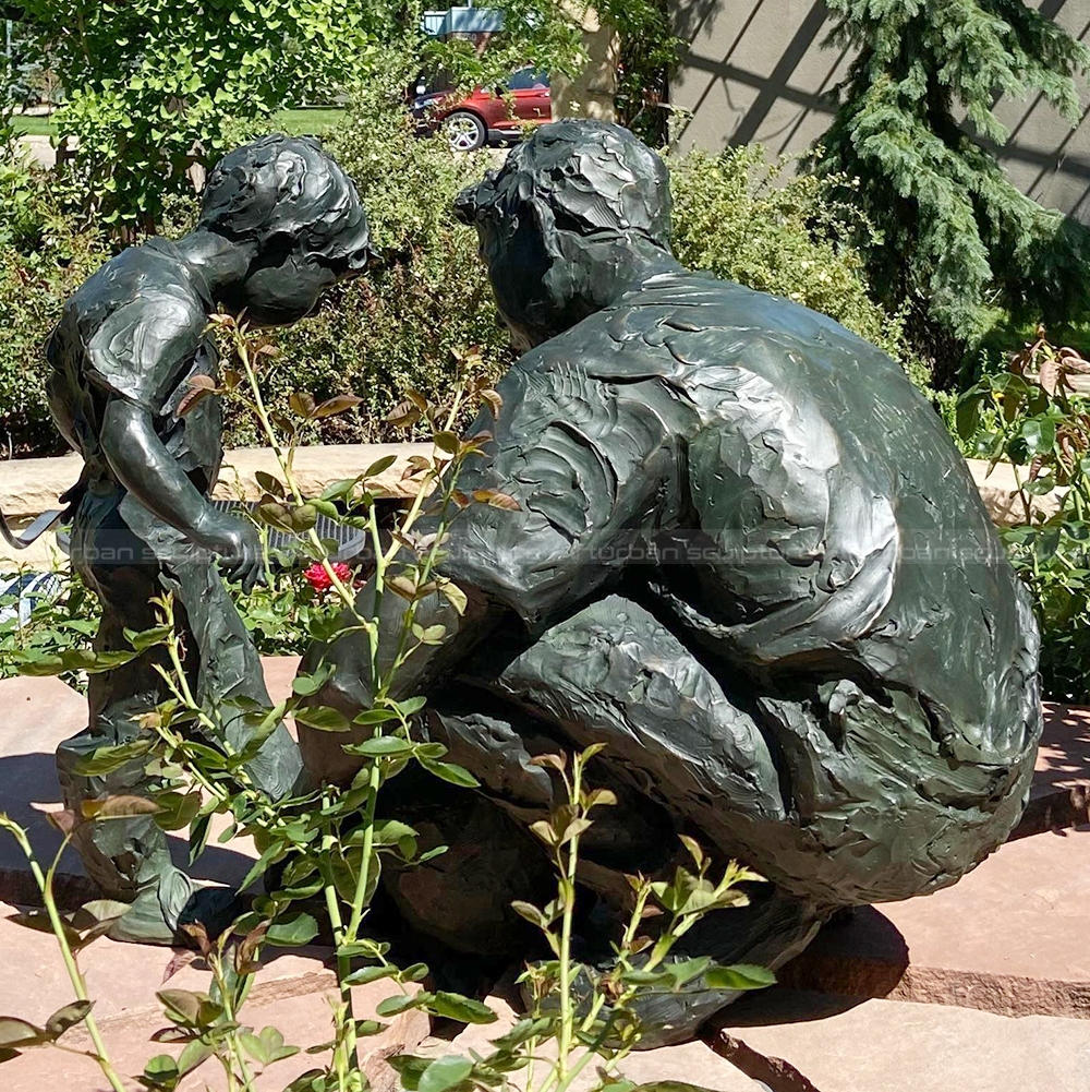 father and child sculpture