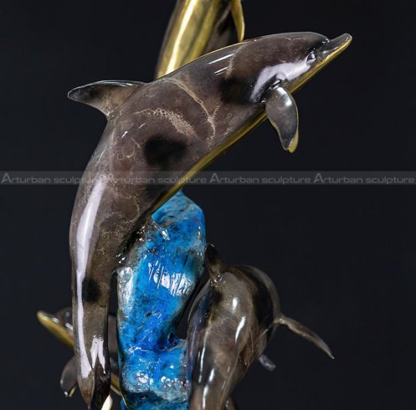 dolphins leaping garden ornament