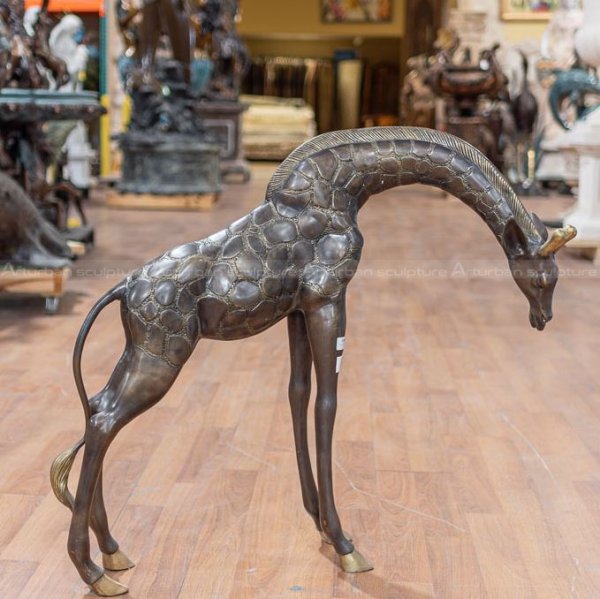 large brass giraffe statue