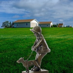 Girl Walking Dog Sculpture