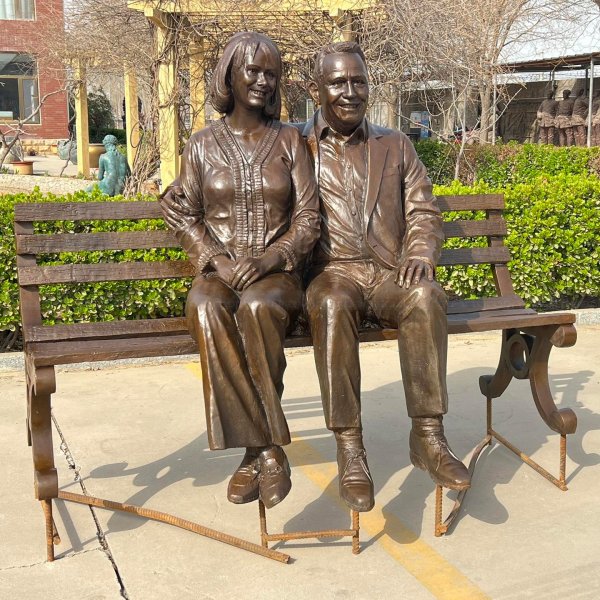 Old Couple Sitting on Bench Statue