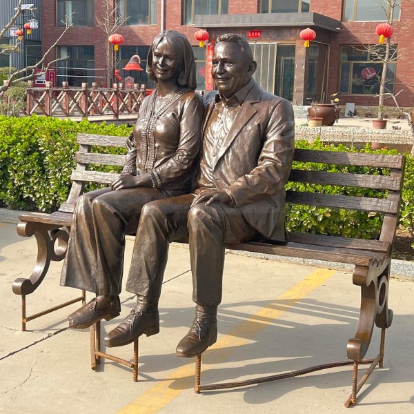 Old Couple Sitting on Bench Statue