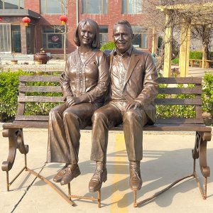 Old Couple Sitting on Bench Statue