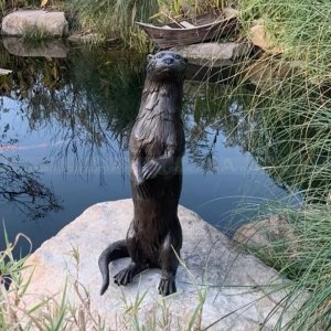 bronze otter statue