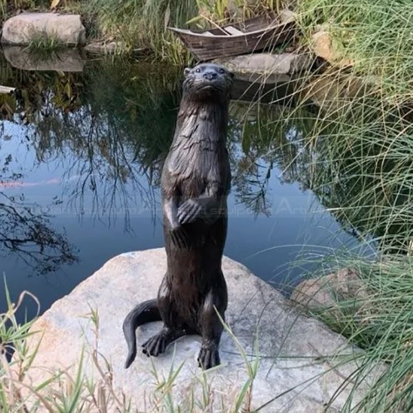 bronze otter statue