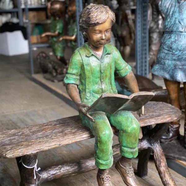 Boy Reading on Bench Statue