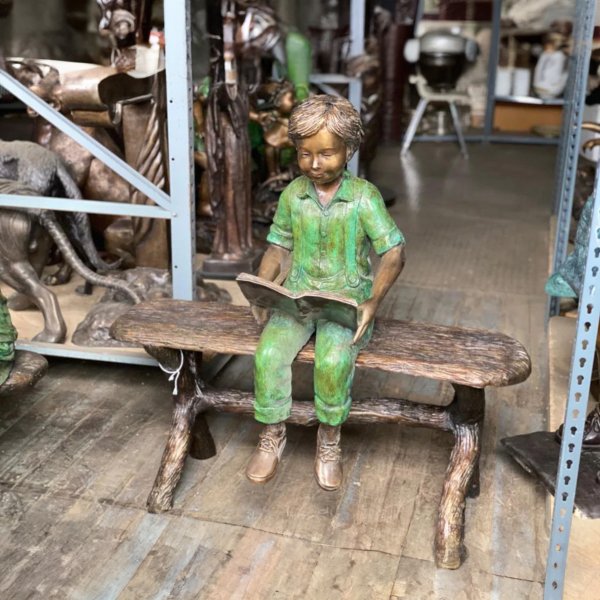 Boy Reading on Bench Statue