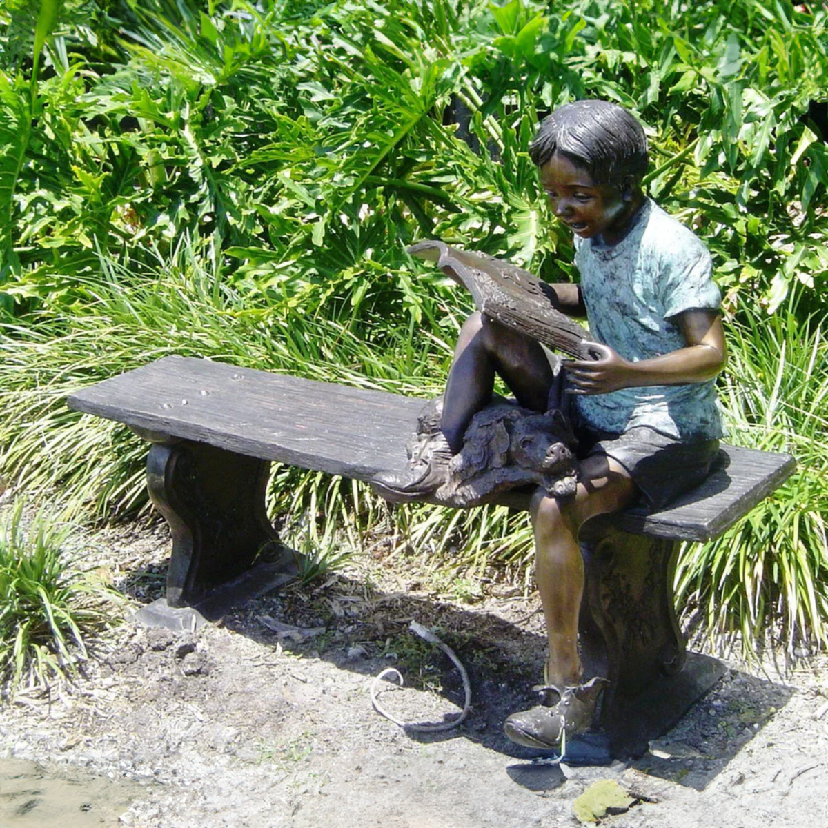 Boy Reading with Dog Statue