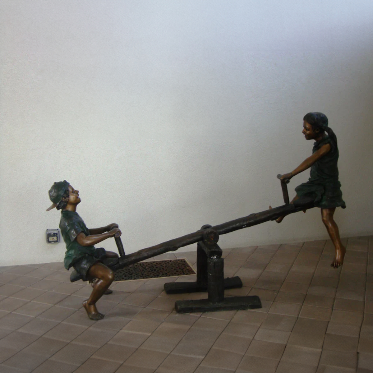 Children on Seesaw statue