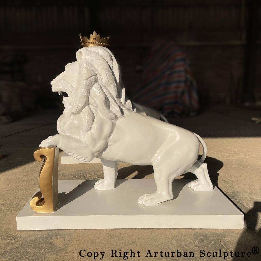 white lion statue with gold crown