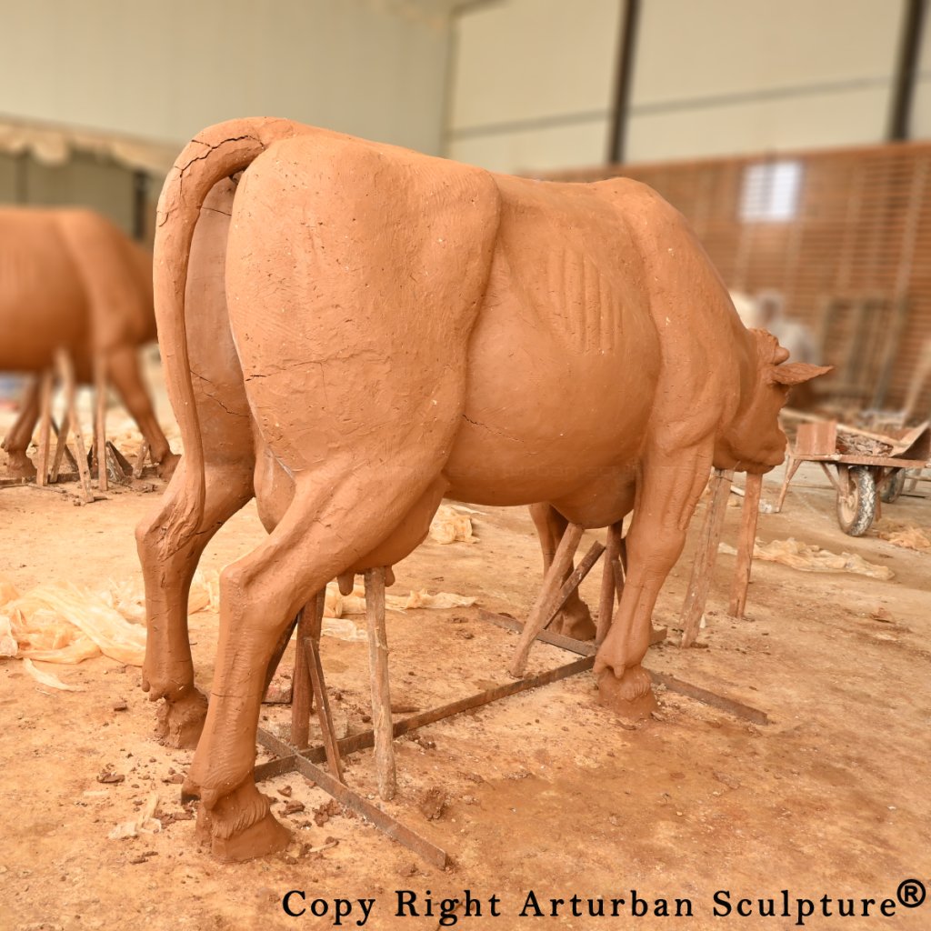 clay mold of dairy cow statue