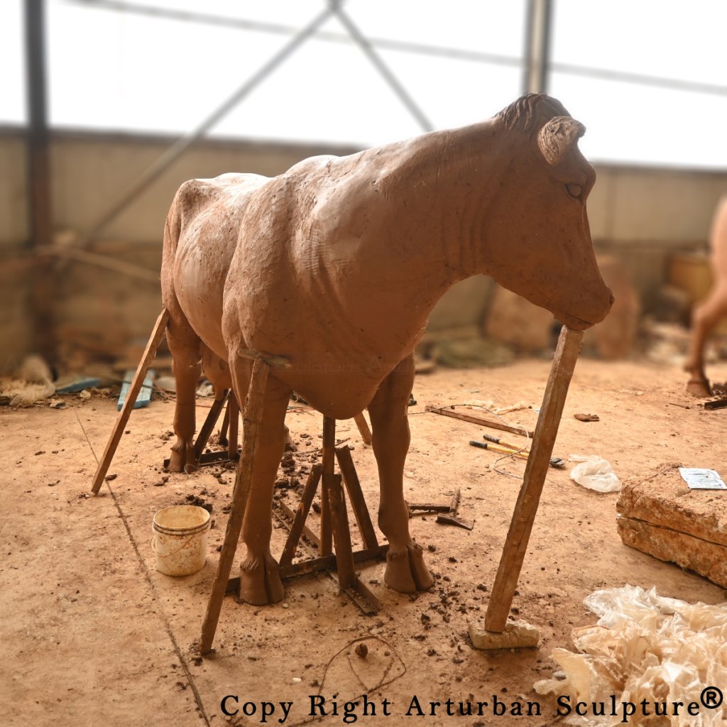 clay mold of dairy cow statue