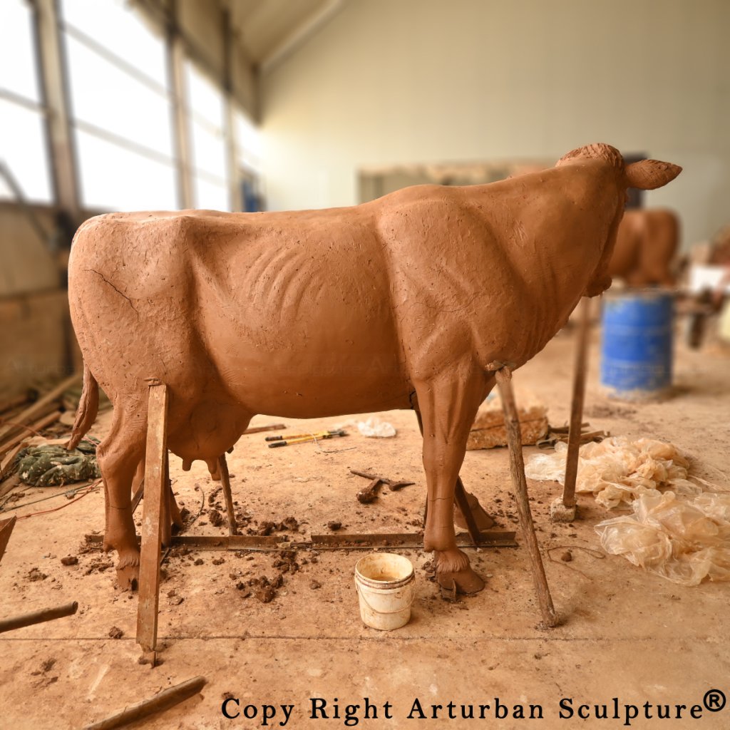 clay mold of dairy cow statue