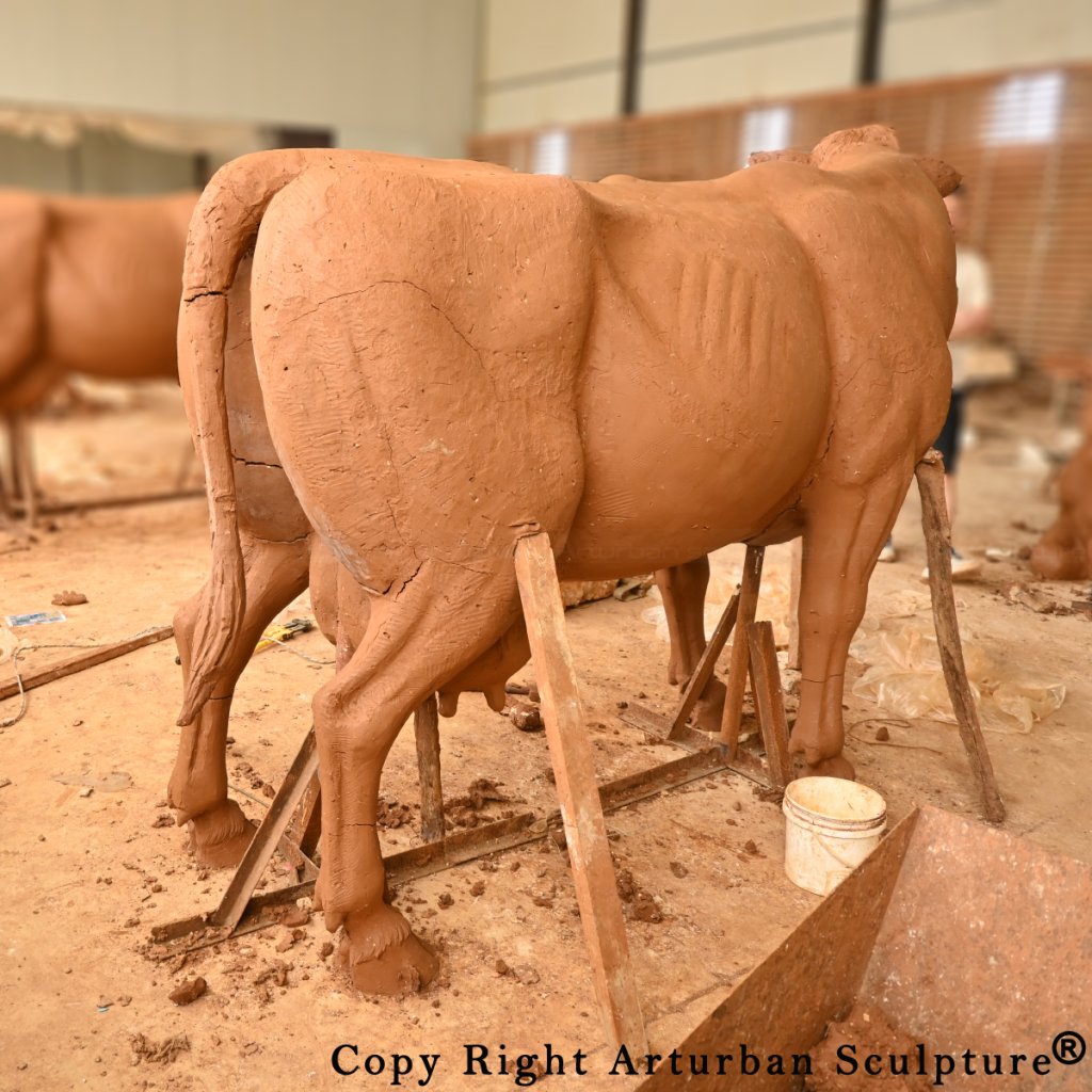 clay mold of dairy cow statue